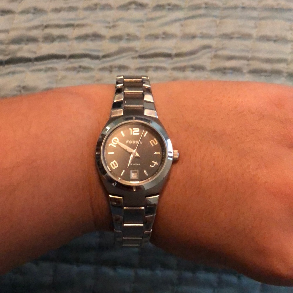 Silver watch with black face